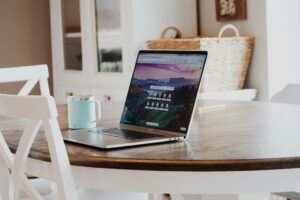 laptop on table with a tea
